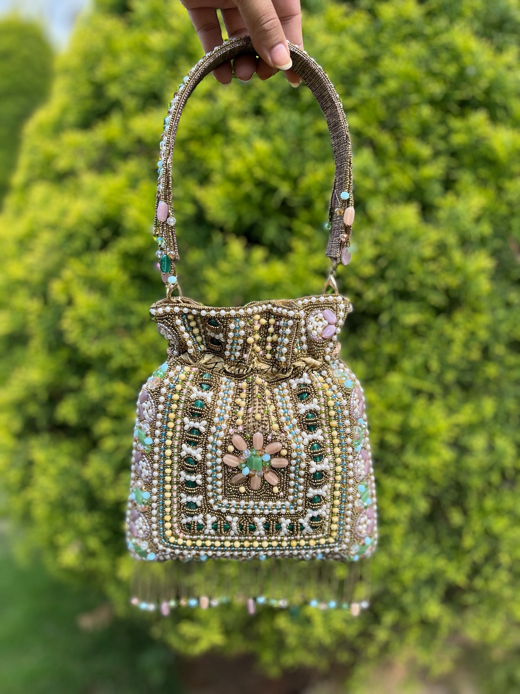 EMERALD STUDDED POTLI