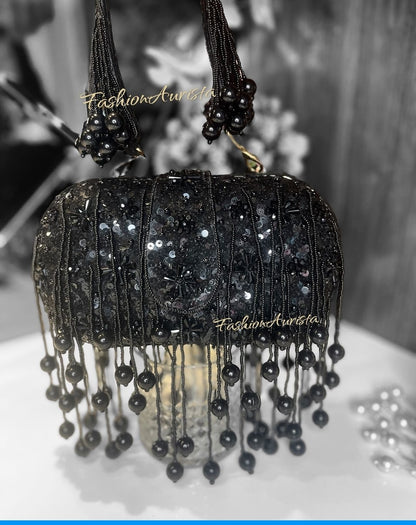 AYESHA CAPSULE CLUTCH